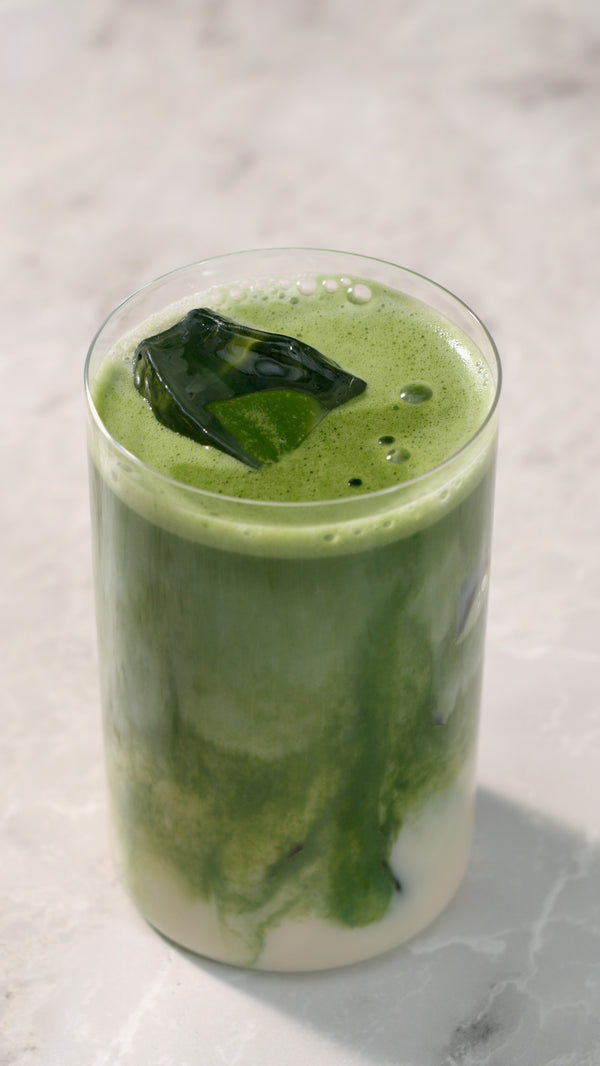 A finished oat milk matcha latte